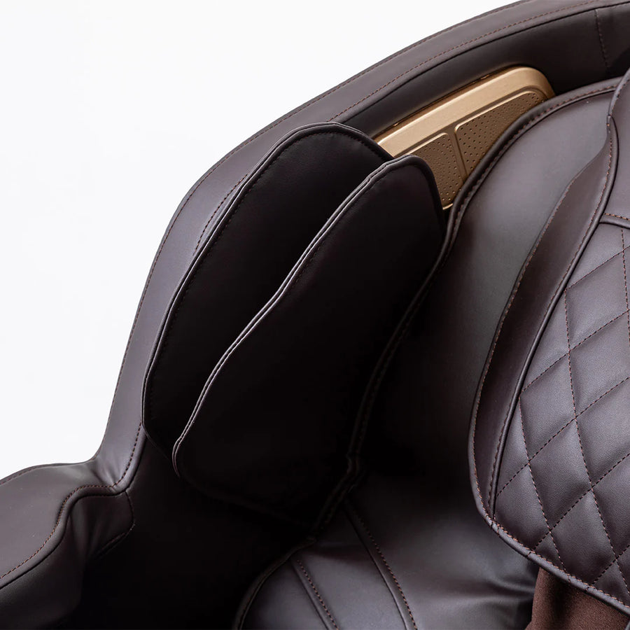 Close-up of a massage chair with quilted design and headrest on a white background | JC Buckman RejuvenateUs 3D Massage Chair