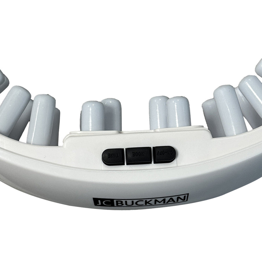 White handheld massager with cylindrical nodes and JC Buckman branding on a white background SeeClearUs Smart Eye Massager with Heat Therapy & Kneading – Relaxation for Dry Eyes & Dark Circles