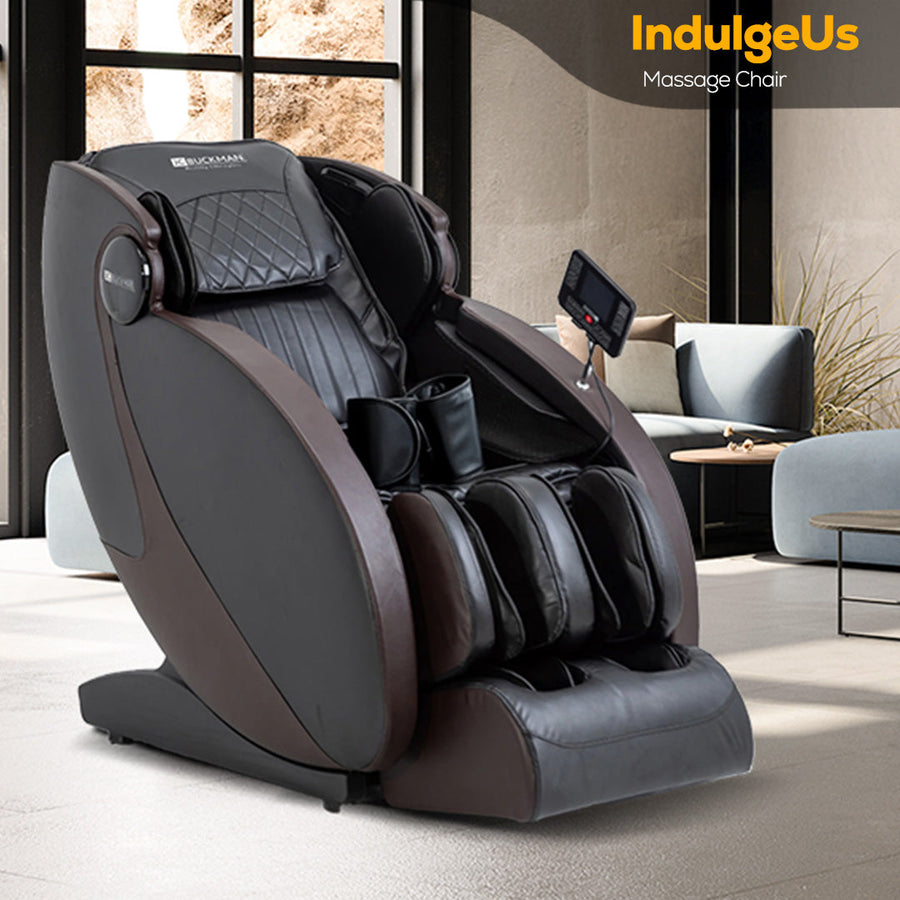 Massage chair with 'IndulgeUs' branding in a modern living room setting. | JC BUCKMAN IndulgeUs Full Body Massage Chair