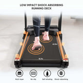 Treadmill with a person using it, highlighting low impact shock absorbing running deck feature.