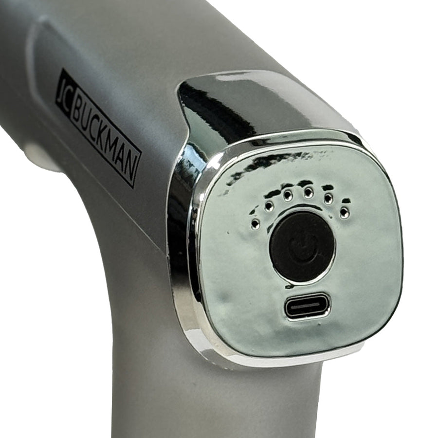Close-up of a gray and chrome tool with 'Buckman' branding on a white background JoyUs Mini Massage Gun – Deep Tissue Percussion Massager for Muscle Recovery